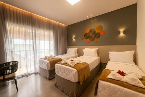 Una cama o camas en una habitación de Uri Pousada