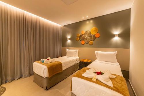 Una cama o camas en una habitación de Uri Pousada