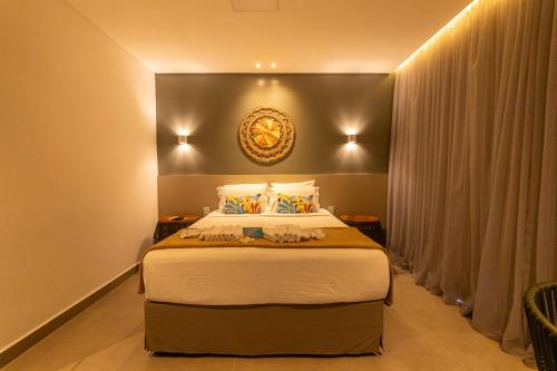 Una cama o camas en una habitación de Uri Pousada