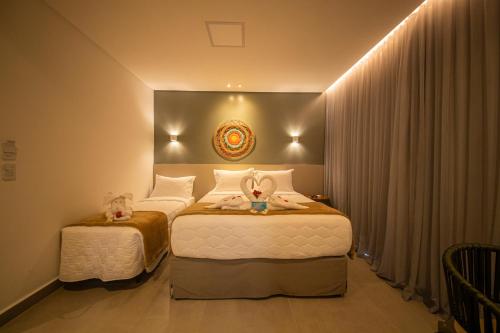 Una cama o camas en una habitación de Uri Pousada