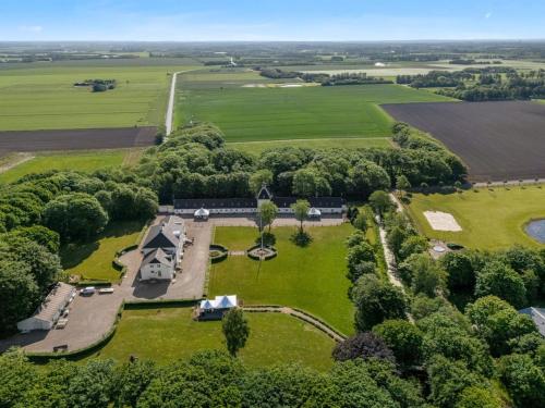 an aerial view of a farm with a field and trees at Apartment Edine - 4-5km from the sea by Interhome in Ulfborg