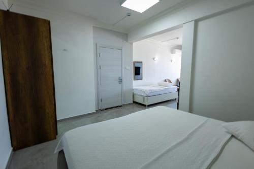 Ένα ή περισσότερα κρεβάτια σε δωμάτιο στο Karamürsel Mohti Otel Fitness Organizasyon