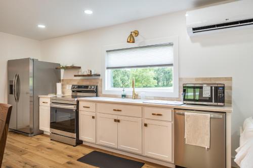 a kitchen with a sink and a microwave at Swancrest in Killbuck