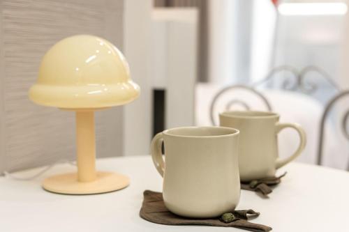 a table with two cups and a hard hat on it at 해운대 웨이브 Haeundae wave in Busan
