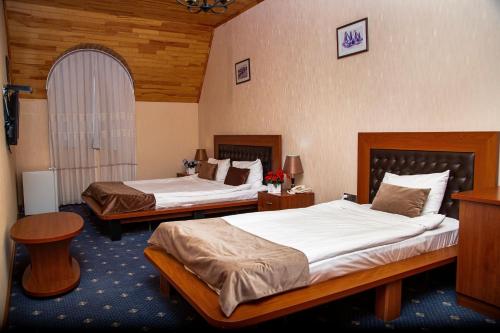 Ένα ή περισσότερα κρεβάτια σε δωμάτιο στο Du Port Hotel Baku
