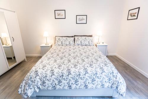 a bedroom with a bed and two night stands at B&B LA CORTE SANTA MARIA in Negrar