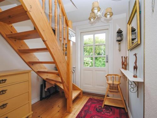 a staircase in a room with a desk and a chair at Holiday Home Ludovic - 7km from the sea by Interhome in Thisted