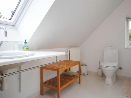 a bathroom with a sink and a toilet at Holiday Home Ludovic - 7km from the sea by Interhome in Thisted