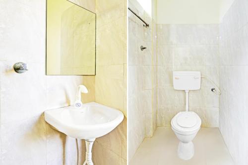 a bathroom with a sink and a toilet at Super Collection O Guduvancheri Railway Station in Chennai