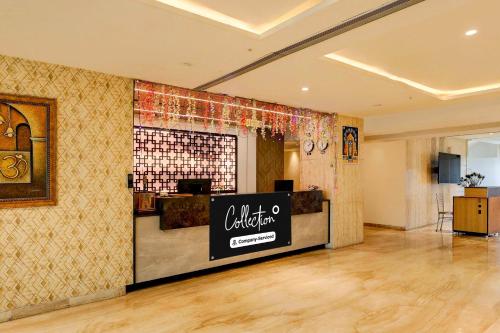 a lobby with a california firm sign on a wall at Collection O Anu Hospital Elur Road in Vijayawāda