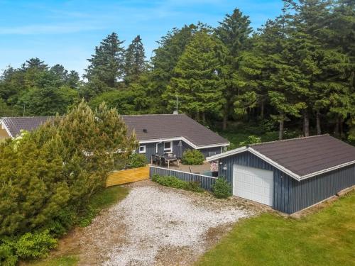 an aerial view of a house with a yard at Holiday Home Aniki - 1-4km from the sea by Interhome in Løkken