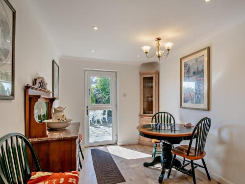 a dining room with a table and chairs at 5 Bed in Newton-in-Cartmel 95876 in High Newton