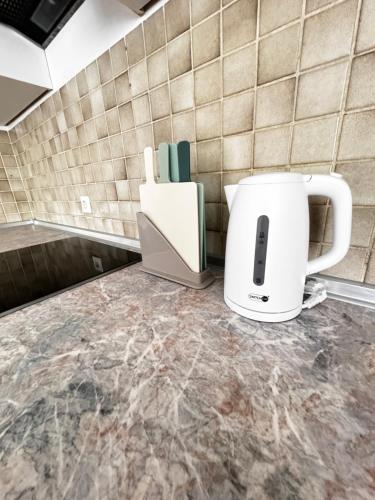 a coffee maker sitting on a counter in a kitchen at Vardi Haus in Ingolstadt