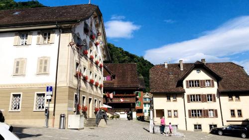 a group of buildings on a street in a town at Organic BnB Froschkoenig Rigi Burggeist in Gersau