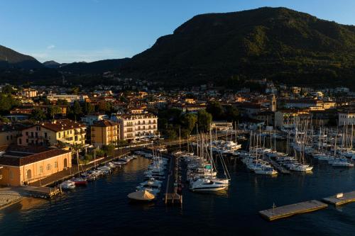 a group of boats are docked in a harbor at Bellerive Lifestyle Hotel in Salò