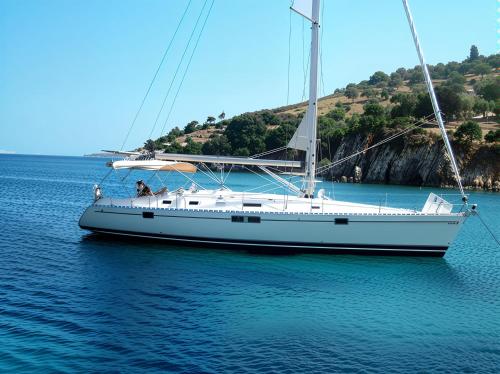 a white sailboat sitting in the water on the ocean at Private yacht, day sail and houseboat in Gros Islet