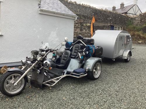 a motorcycle parked next to a trailer at Bryn Guest House in Conwy