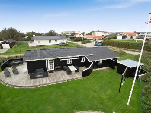 an overhead view of a black house with a yard at Holiday Home Wiebke - 200m from the sea by Interhome in Blokhus