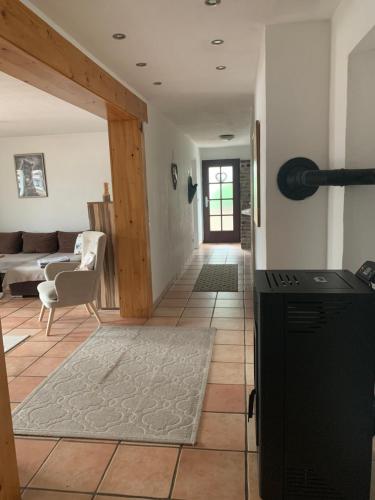 a living room with a couch and a table at Ferienwohnung Bergblick in Winterberg