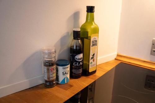 two bottles of wine sitting on top of a counter at Central Spacious Studio Apt I 5 Minutes to Metro in Copenhagen