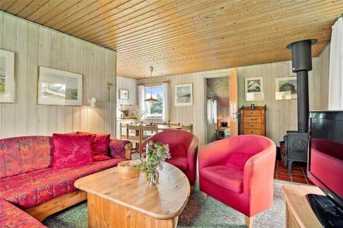a living room with a couch and two chairs and a table at LN1781-Hjorring-Vadehavsvej-14 in Hjørring