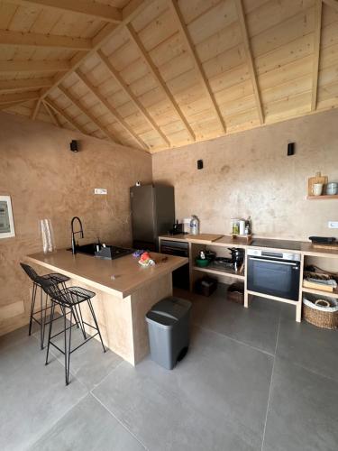 a kitchen with a counter and a island in a room at Casa Arriettas in Tijarafe