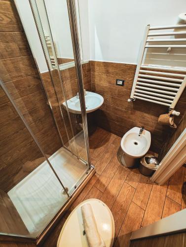 a bathroom with a shower and a toilet at MVM Apartment in Rome