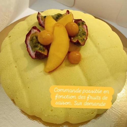a cake with fruit and vegetables on top of it at La Bergerie à Palleau, Les Blés Dorés et Les Graines de Lin à Corgengoux, proches de Beaune et de ses villages viticoles in Palleau