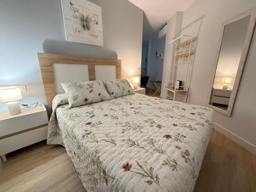 En eller flere senge i et værelse på Apartamento Fama