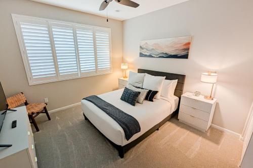 a bedroom with a bed and a window at Blue Agave Dreams in Marana