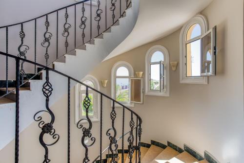 a staircase in a home with black and white stairs at One bedroom apartment A 401 by Peaks Palm Beach Piazza Sahl Hasheesh in Banī Ghālib