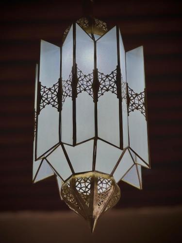 a light fixture hanging from a ceiling at Riad Shama in Rabat