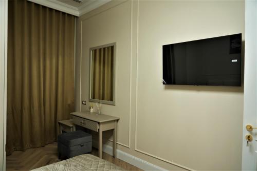 Télévision ou salle de divertissement dans l'établissement Nest One