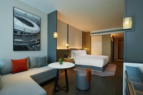 Ένα ή περισσότερα κρεβάτια σε δωμάτιο στο Radisson Blu Hotel, Shanghai Stadium
