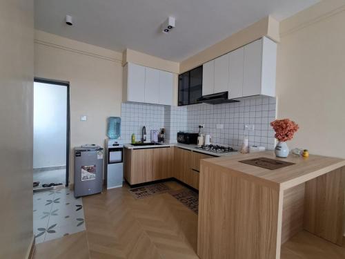 Η κουζίνα ή μικρή κουζίνα στο Caster one-bedroom apartment JKIA