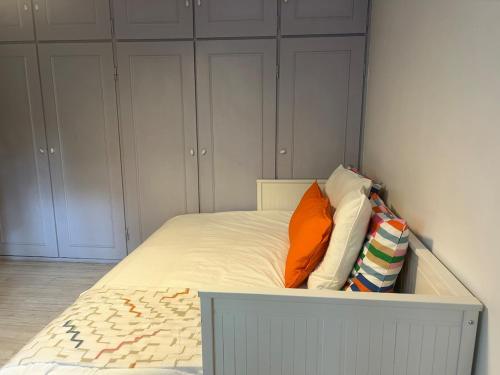 a bed with two pillows on it in a room at Villa haut de gamme 11 personnes jacuzzi privé in Lacanau