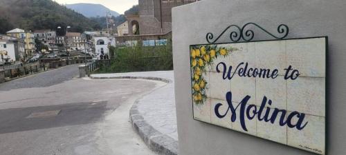 a sign that says welcome to nitzerland on the side of a road at CasaFiore Guest House in Vietri sul Mare