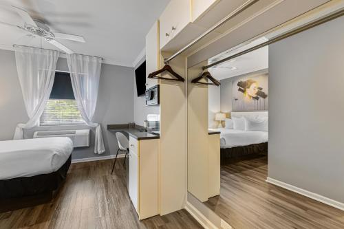 a hotel room with two beds and a desk at Hotel Chicago West Loop, SureStay Collection by Best Western in Chicago