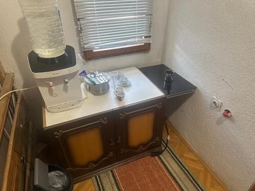 a blender sitting on a table in a room at Rooms Struga in Struga