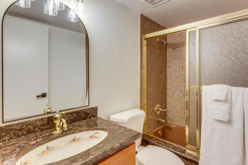 a bathroom with a sink and a shower and a toilet at 5 Mi to Colorado River Yuma Gem with Pool Access! in Yuma
