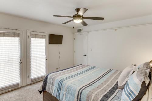 a bedroom with a bed and a ceiling fan at 5 Mi to Colorado River Yuma Gem with Pool Access! in Yuma
