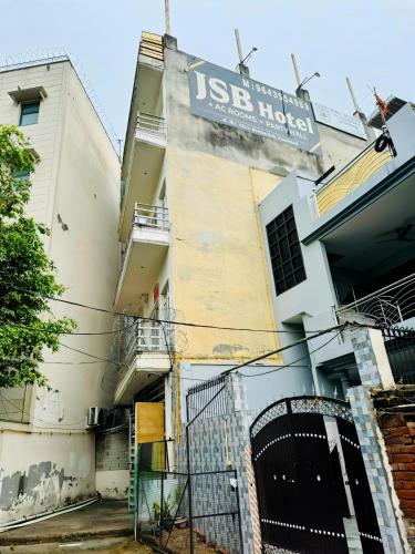 a building with a sign on the side of it at JSB HOTEL in Faridabad