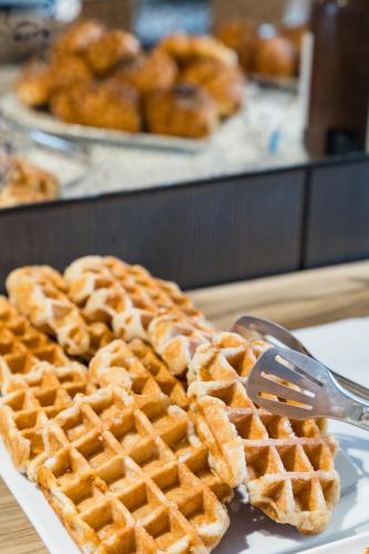 a waffle with a fork on a plate with at Borgo Le Terrazze in Bellagio