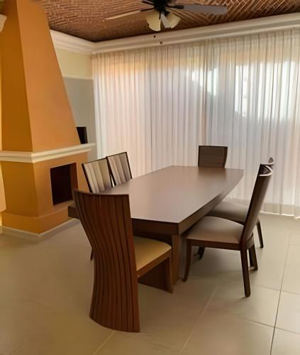 a dining room with a table and chairs at Cheerful residential house in the heart of Chapala in Chapala