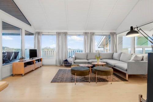 a living room with a couch and a tv at LN1791-Hjorring-Hongardsvej-1 in Hjørring