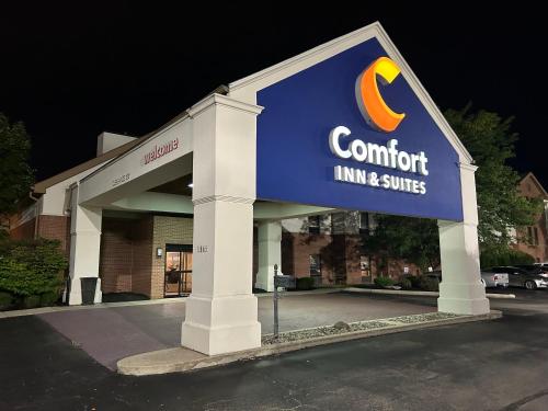 a building with a sign for a comfort inn and suites at Comfort Inn & Suites Toledo North in Toledo