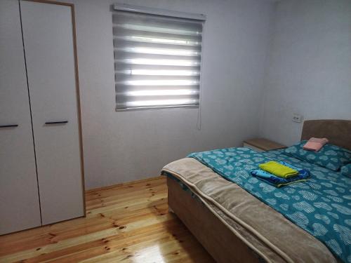 Ένα ή περισσότερα κρεβάτια σε δωμάτιο στο DeLux Apartment Helena 2