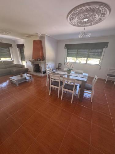 a living room with a table and a couch at House Santiago in Ponte de Lima in Ponte de Lima