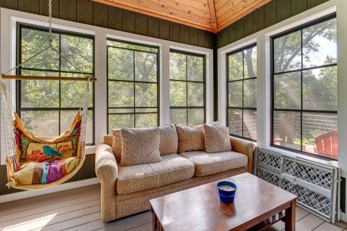 a living room with a couch and a table at Lake Geneva Family Gem with Fenced Dog Run! in Lake Geneva