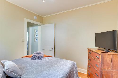 a bedroom with a bed with a stuffed animal on it at Lake Geneva Family Gem with Fenced Dog Run! in Lake Geneva